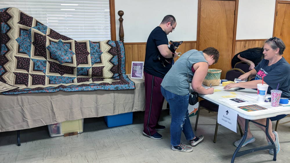 Our very own Alita Leadbeater selling the Quilt Show Raffle Tickets